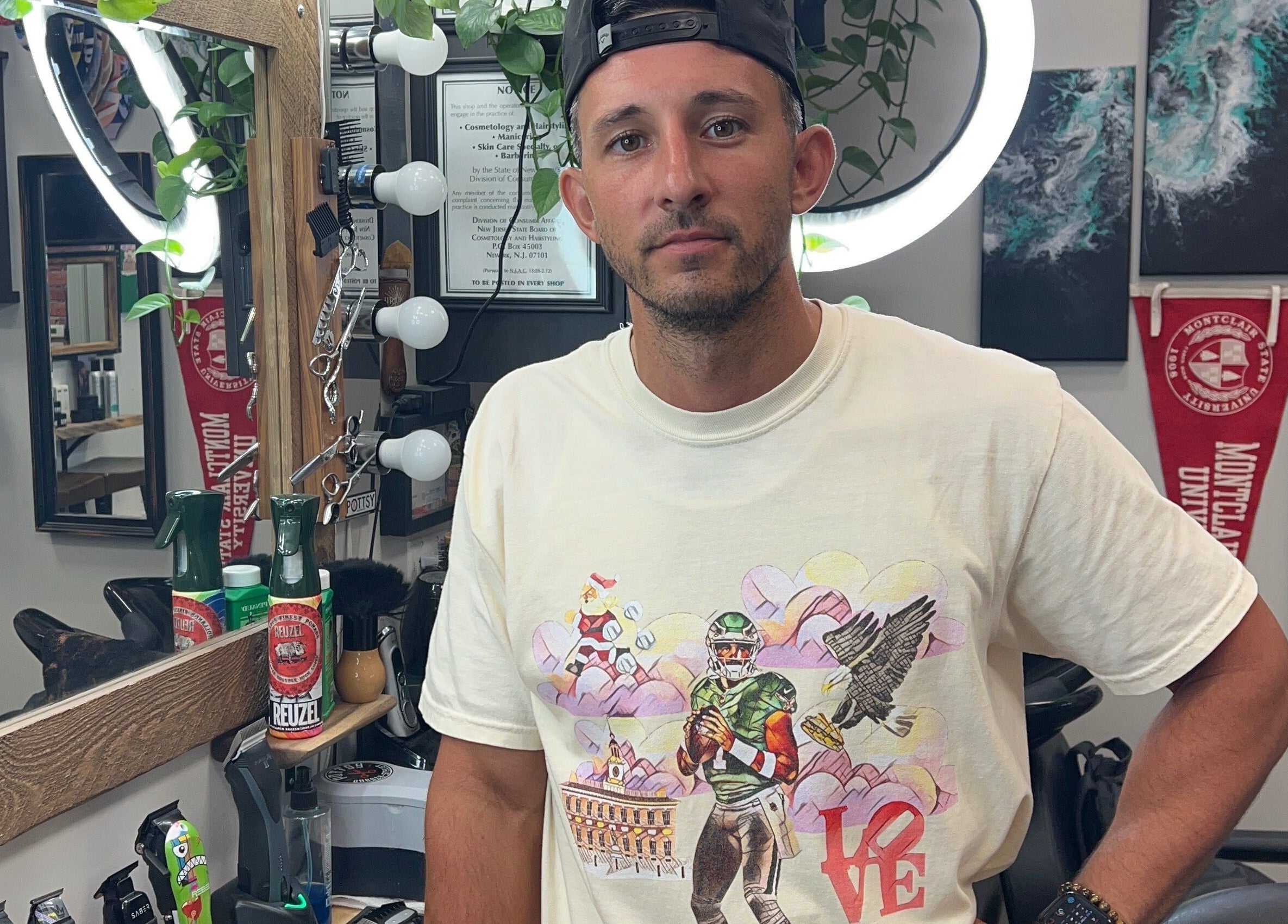 A vibrant moment inside Pottsy Barber Suite in Cinnaminson, New Jersey, US, featuring stylish decor and tools.