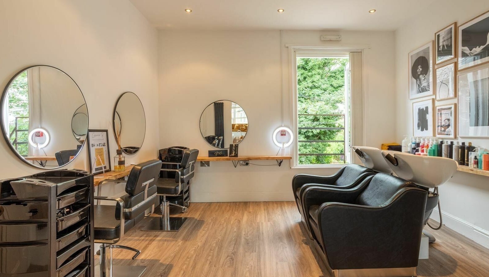 Modern salon interior at Gracie B Ltd, West Bridgford, England, GB with stylish mirrors and seating.