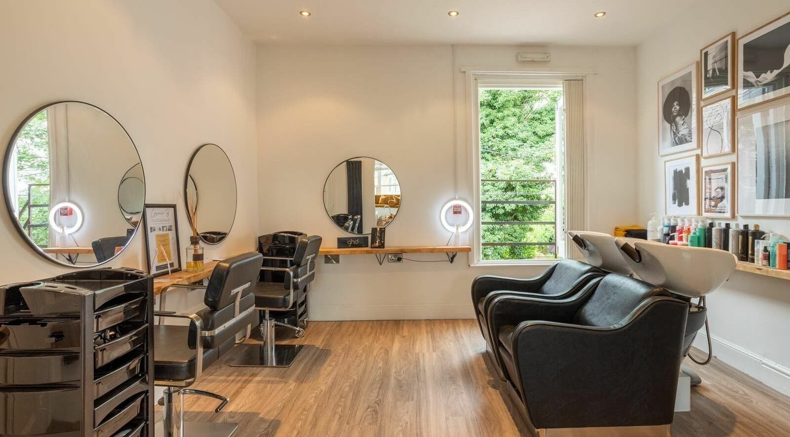 Modern salon interior at Gracie B Ltd, West Bridgford, England, GB with stylish mirrors and seating.