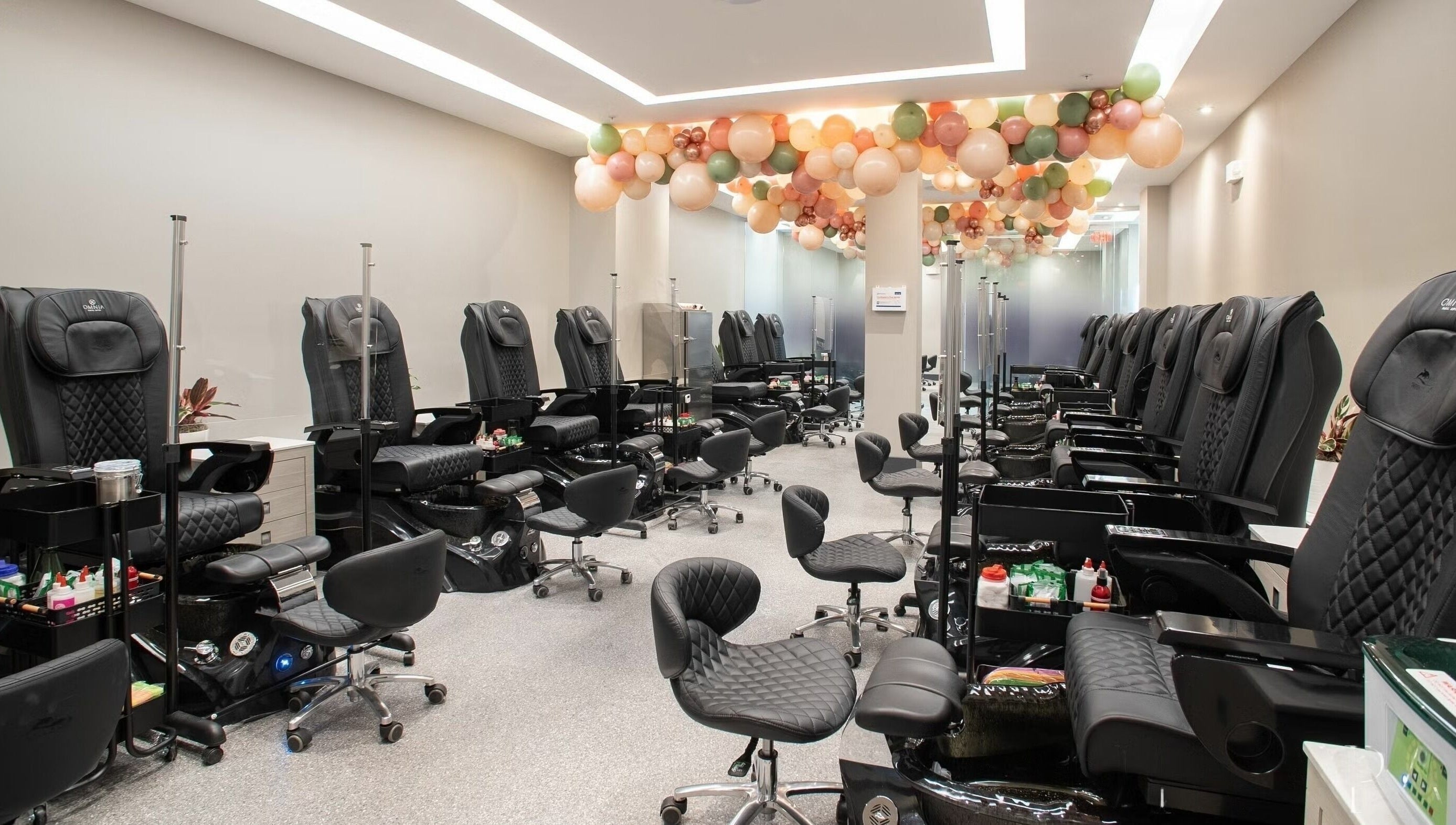 Stylish nail spa chairs in Omnia Spa - Granite Run, Media, Pennsylvania, US, exude elegance and comfort.