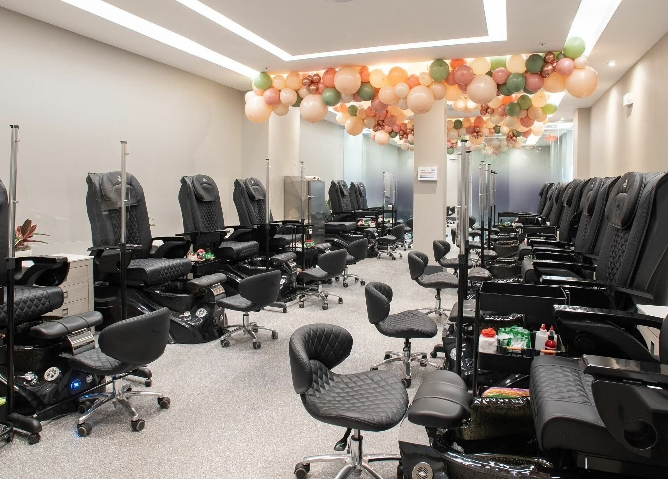 Stylish nail spa chairs in Omnia Spa - Granite Run, Media, Pennsylvania, US, exude elegance and comfort.