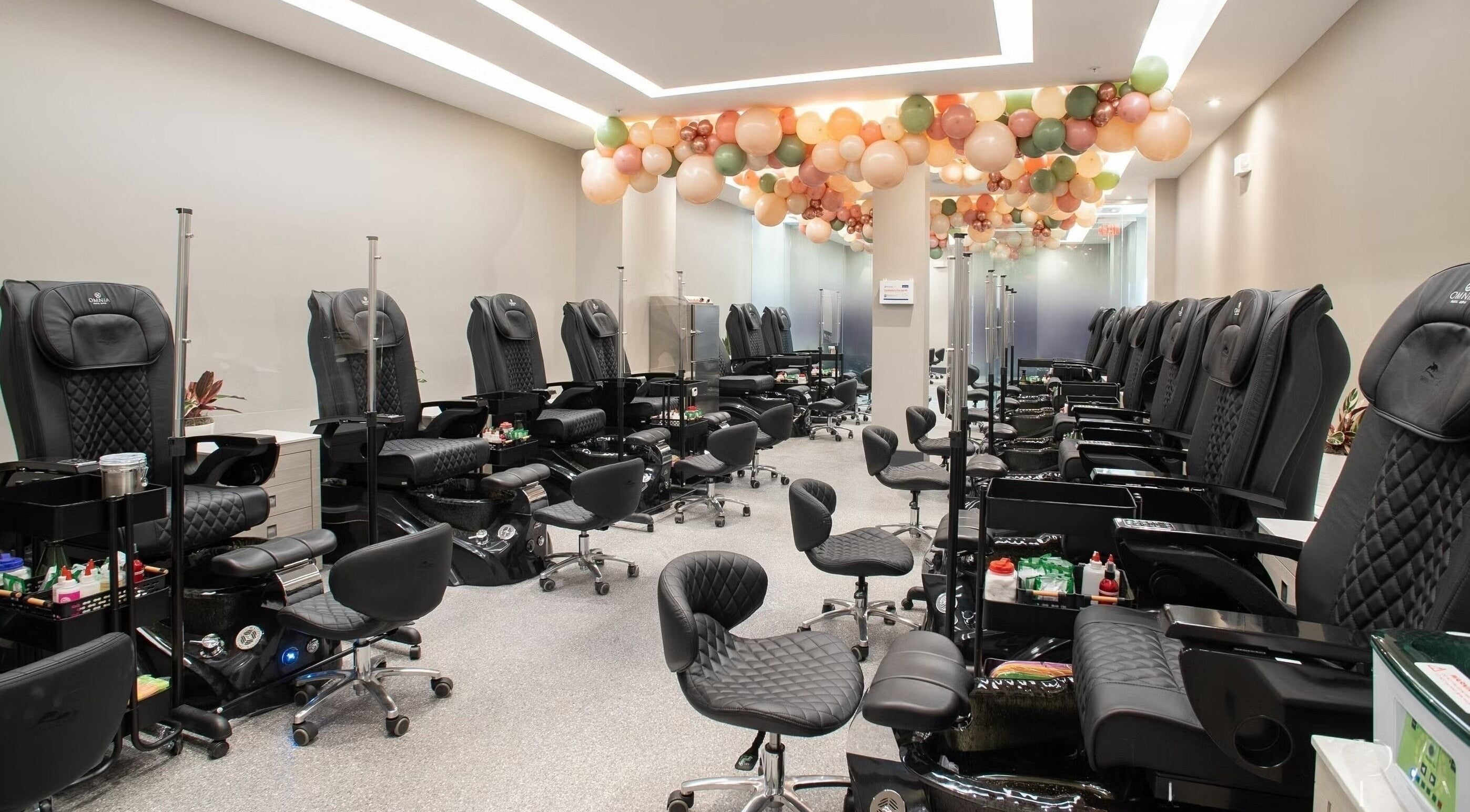 Stylish nail spa chairs in Omnia Spa - Granite Run, Media, Pennsylvania, US, exude elegance and comfort.