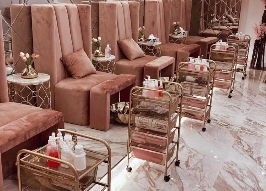 Elegant seating area in Cerise Beauty Salon, Dubai, Dubai, AE, with plush chairs and golden accents.