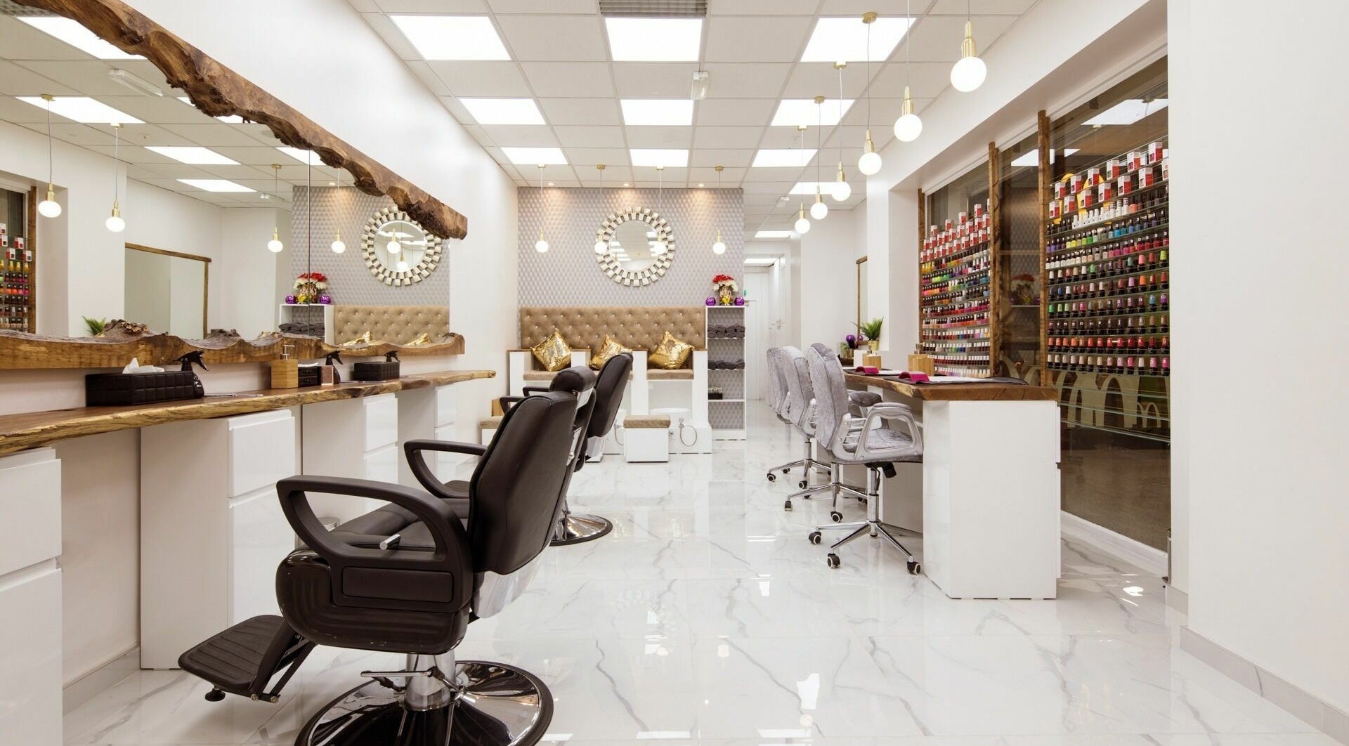 Modern interior of Smart Look Beauty Mayfair, London, England, GB with stylish workstations and vibrant decor.