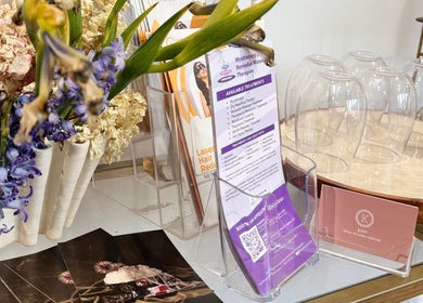 OM Spa & Beauty brochure stand with flowers in Melbourne, Victoria, AU.