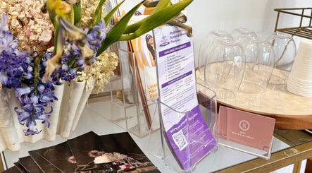 OM Spa & Beauty brochure stand with flowers in Melbourne, Victoria, AU.