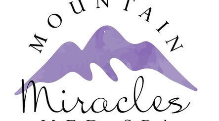 Logo of Mountain Miracles Med Spa in Rangeley, Maine, US, featuring stylized purple mountains.