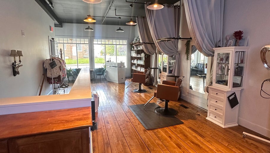 Warm and inviting interior of Mountain Miracles Med Spa in Rangeley, Maine, US with wooden floors and elegant decor.