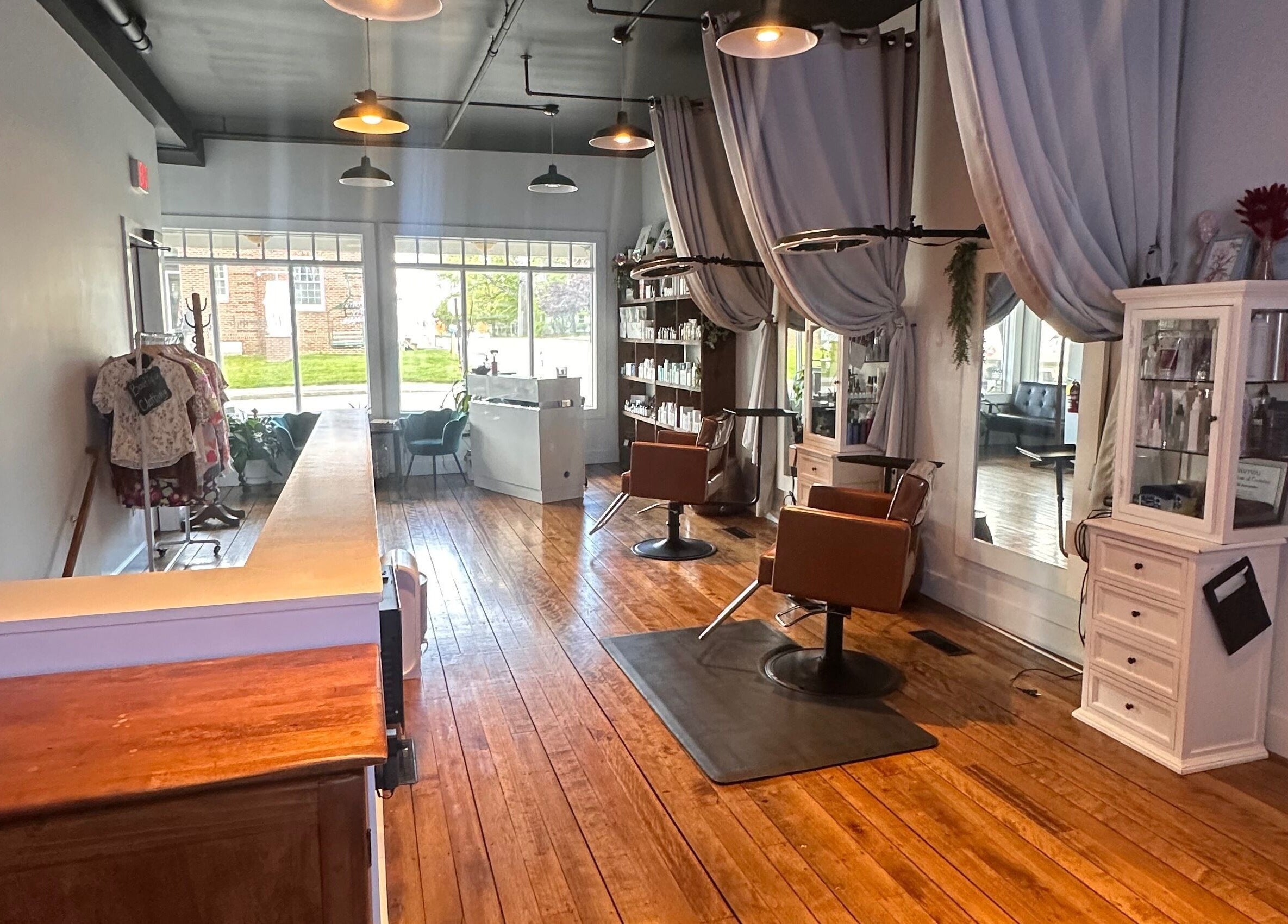 Warm and inviting interior of Mountain Miracles Med Spa in Rangeley, Maine, US with wooden floors and elegant decor.