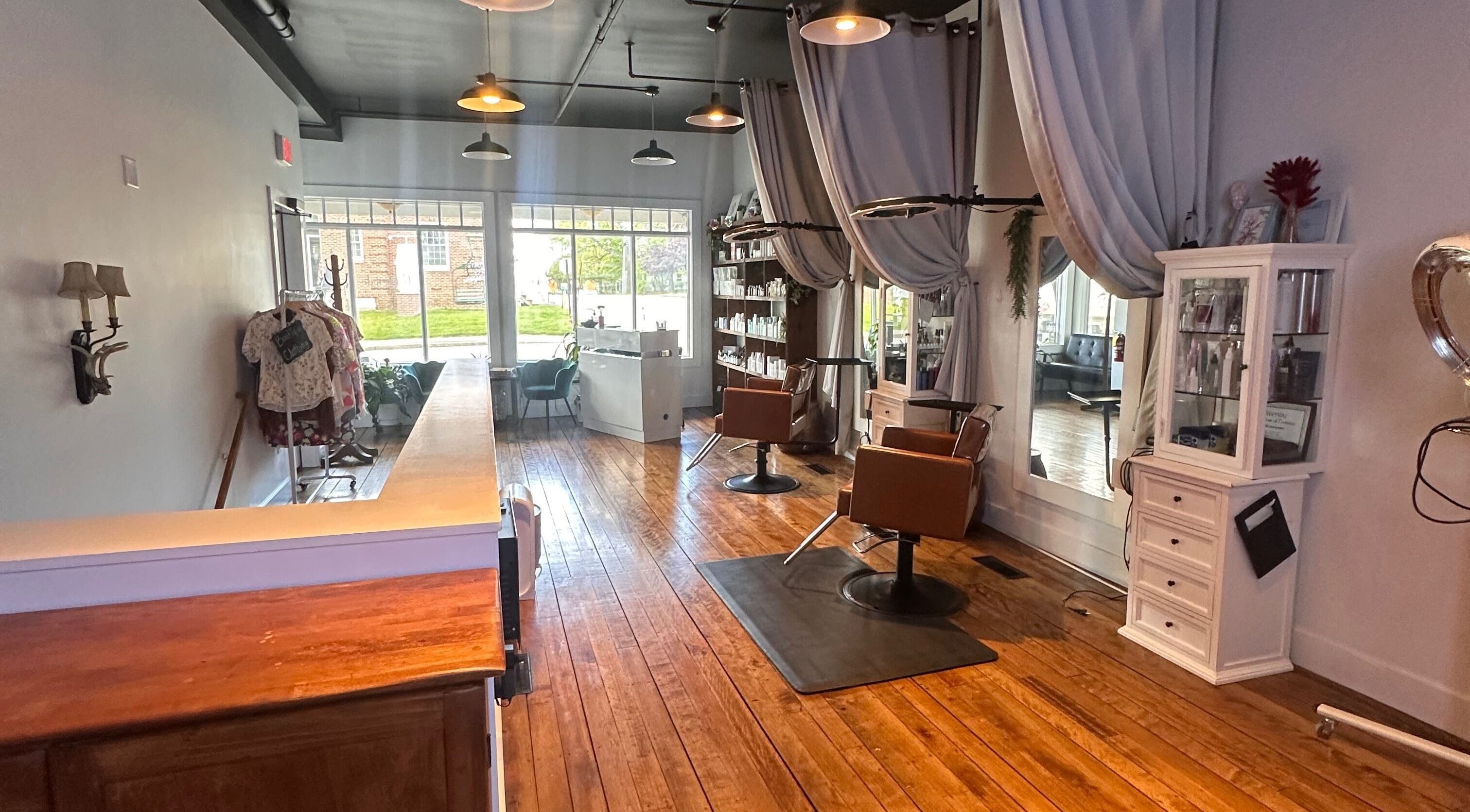 Warm and inviting interior of Mountain Miracles Med Spa in Rangeley, Maine, US with wooden floors and elegant decor.