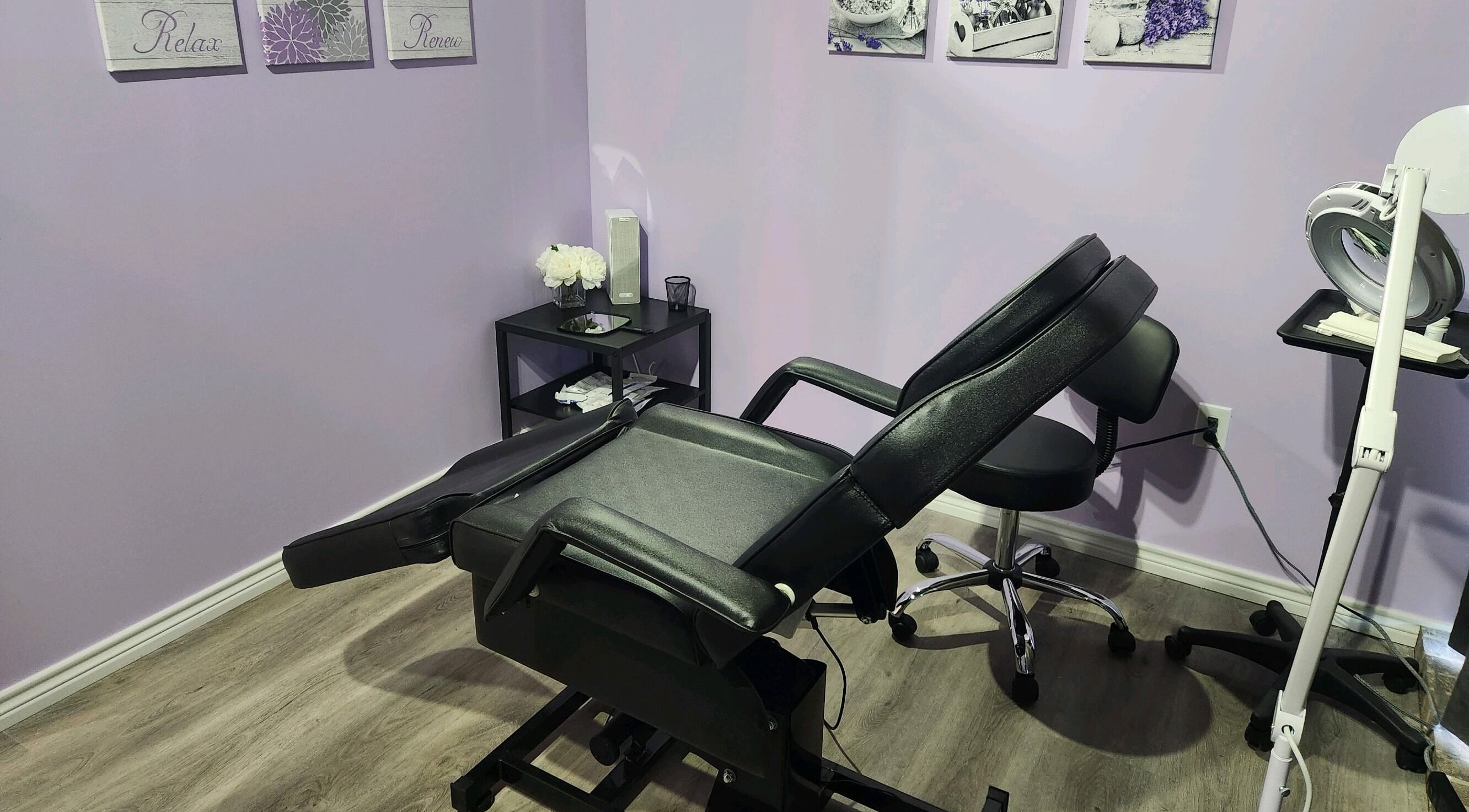 Comfortable treatment room at New You MedSPA Southwest in Houston, Texas, US, with massage chair and decor.