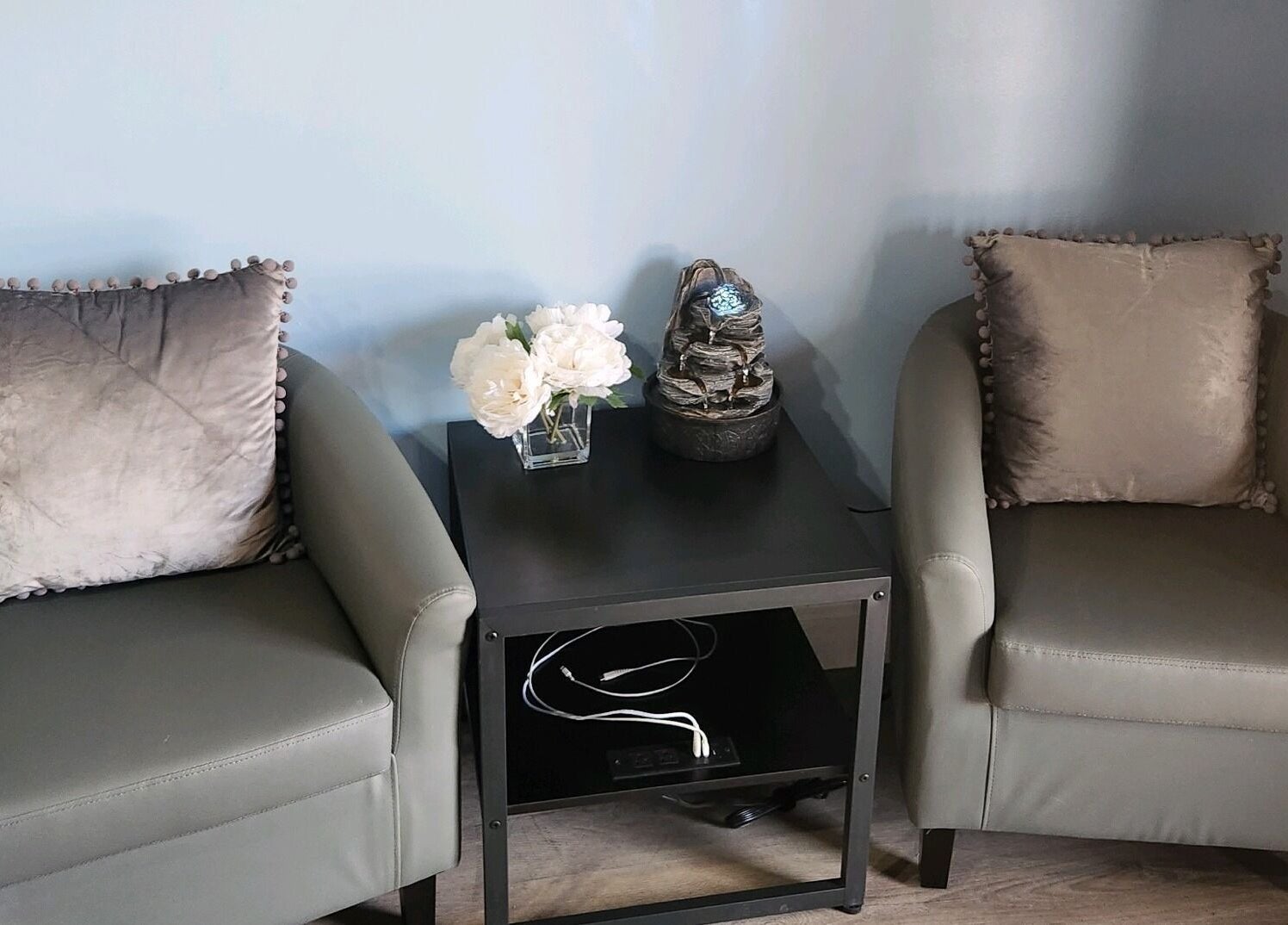 Elegant seating area at New You MedSPA Southwest, Houston, Texas, US with plush chairs and a calming table decor.