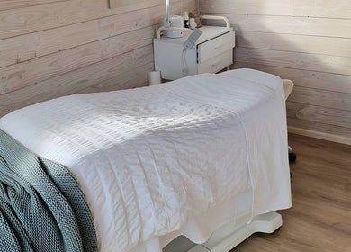Serene treatment room at Sarah Black, Culverden, Canterbury, NZ with cozy massage table.