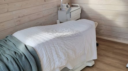 Serene treatment room at Sarah Black, Culverden, Canterbury, NZ with cozy massage table.