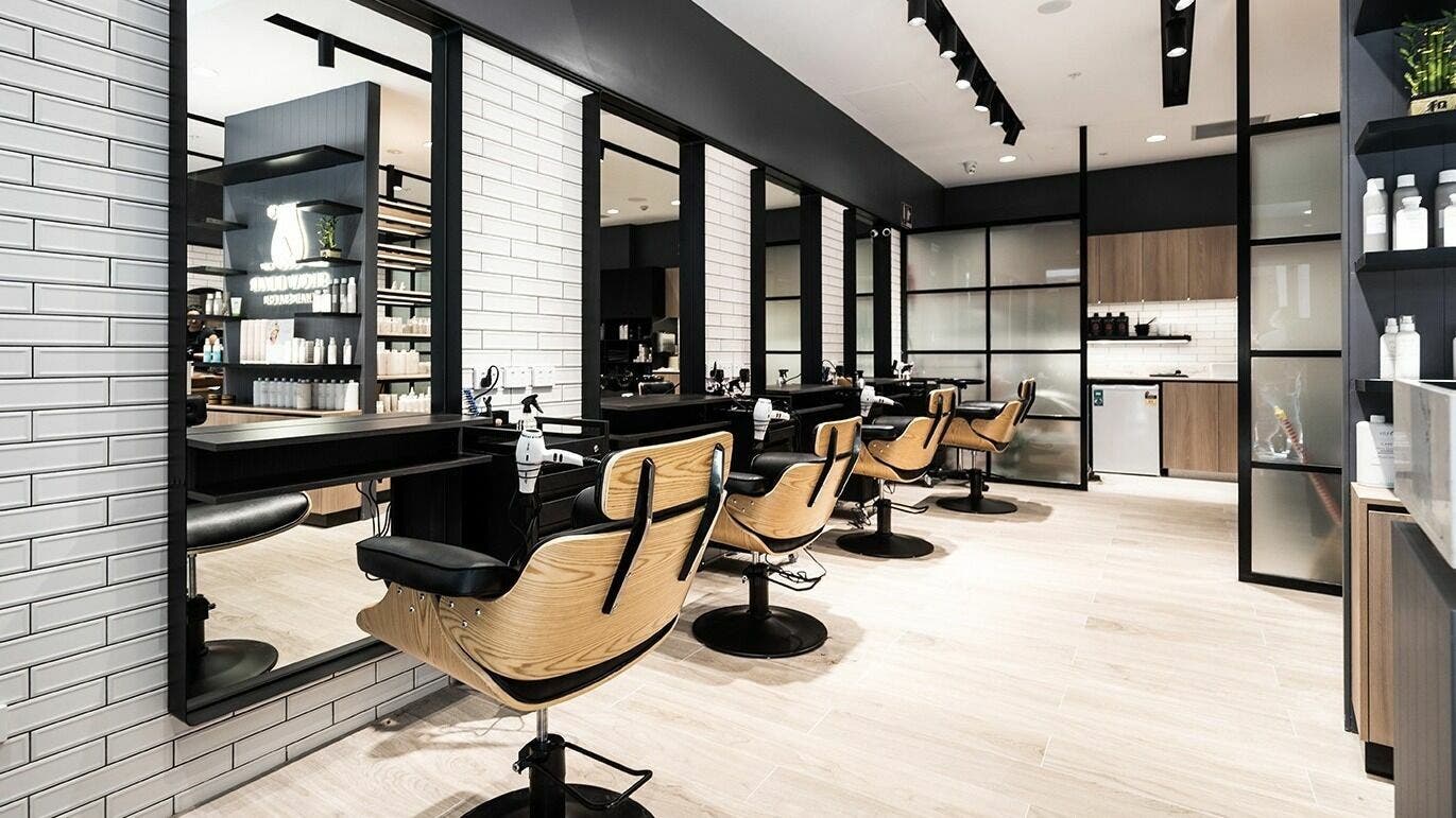 Modern interior of Lane Cove Market Square Snowbear Hairdressing in Lane Cove, New South Wales, AU with stylish chairs.