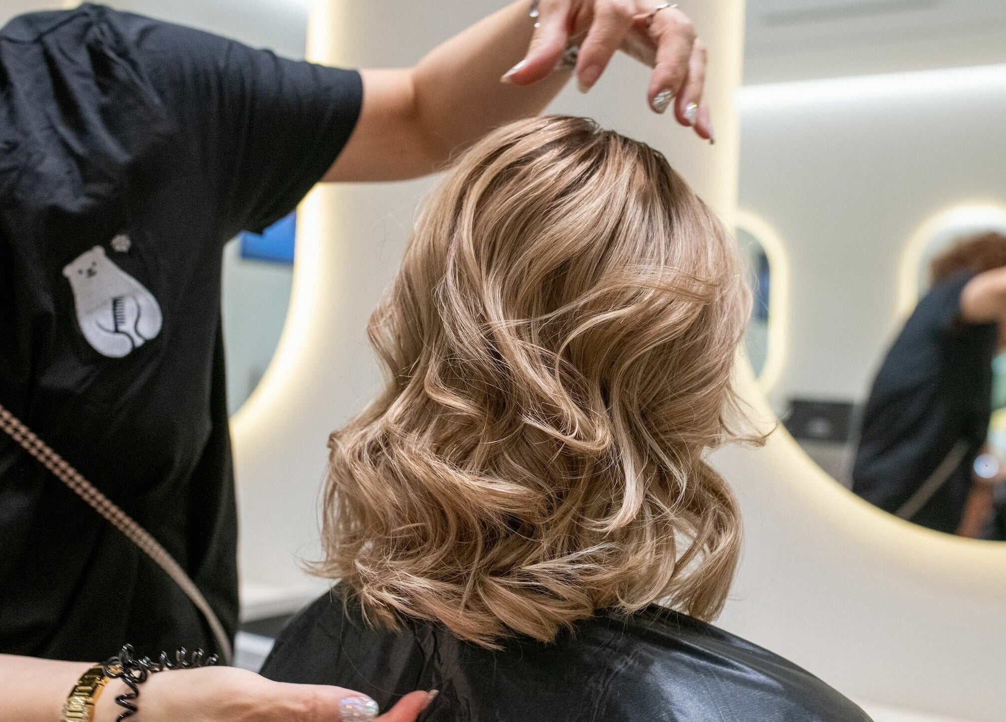 Expert hairstylist crafting a chic hairstyle at Macquarie Shopping Centre Snowbear Hairdressing, Macquarie Park, NSW.