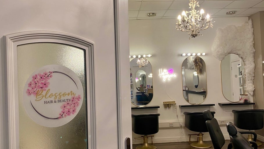 Elegant Dumbarton salon interior with chic mirrors and chandelier in Dumbarton, Scotland, GB.