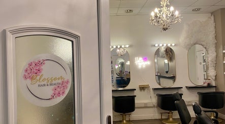 Elegant Dumbarton salon interior with chic mirrors and chandelier in Dumbarton, Scotland, GB.