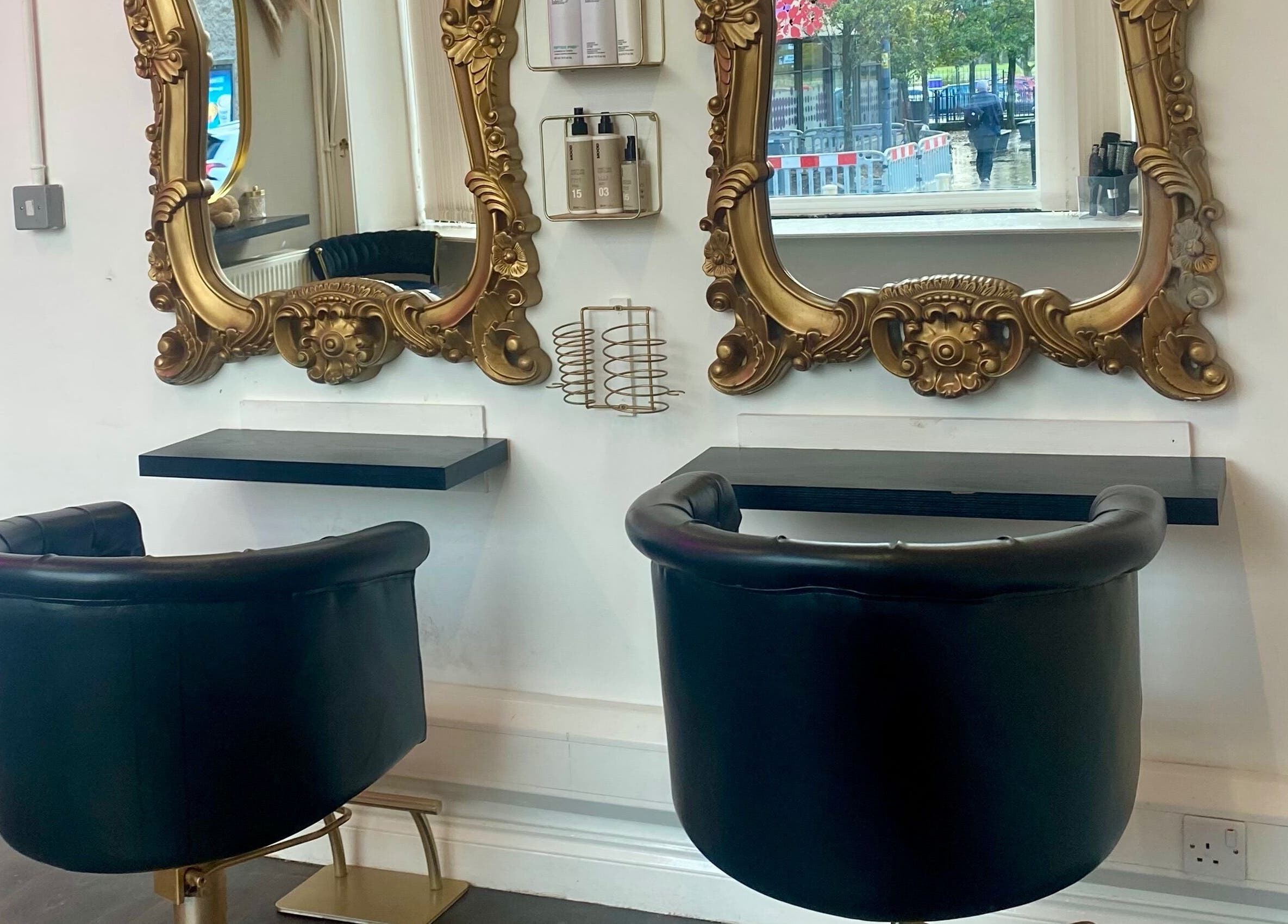 Elegant hair salon chairs and mirrors at Blossom Hair & Beauty in Dumbarton, Scotland, GB.