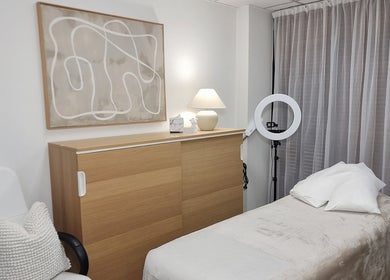 Relaxing treatment room at Delta Beauty Salon, Phillip, ACT with a cozy bed and soft lighting.