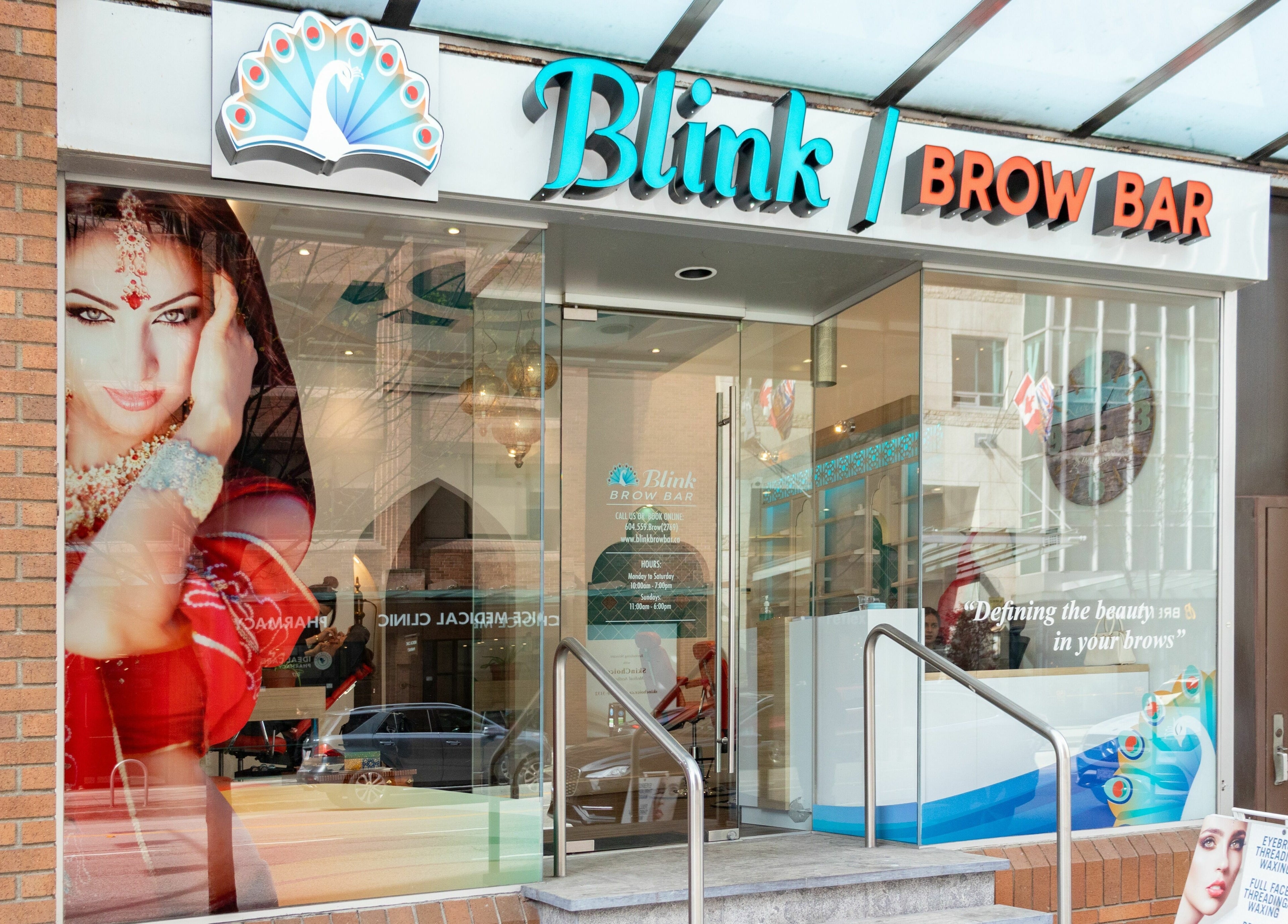 Front view of Blink Brow Bar in Vancouver, British Columbia, CA, showcasing its stylish glass entrance.
