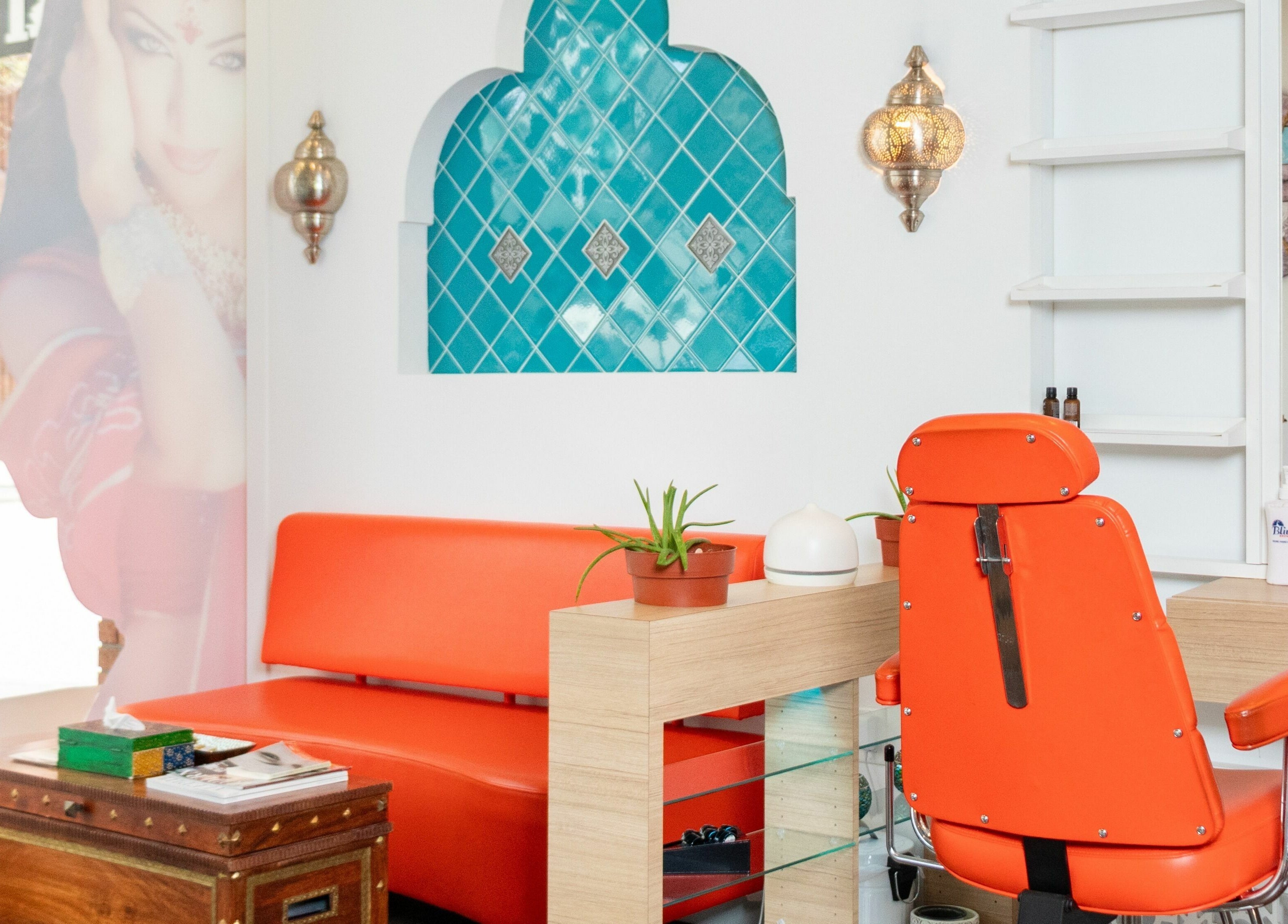 Bright interior of Blink Brow Bar in Vancouver, British Columbia, CA with orange decor and elegant accents.