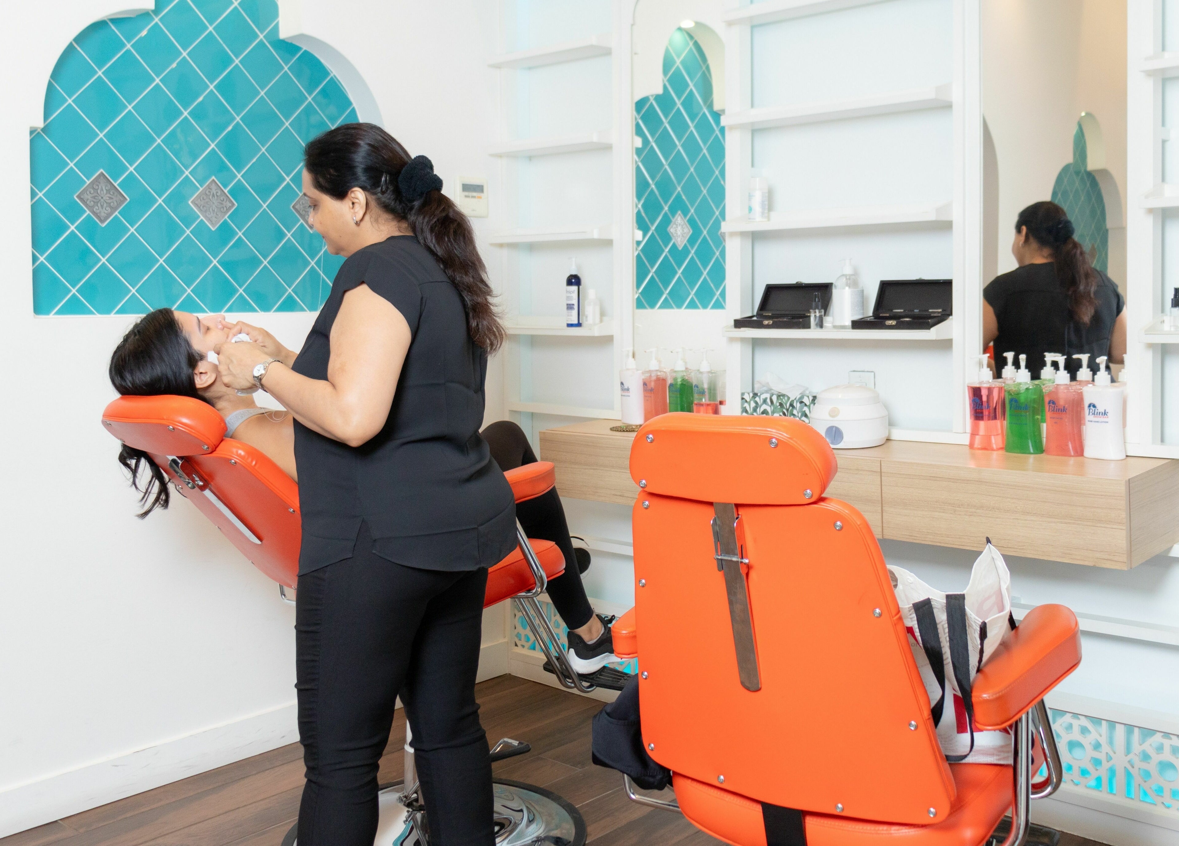 Experience eyebrow threading at Blink Brow Bar in Vancouver, British Columbia, CA with modern, vibrant decor.