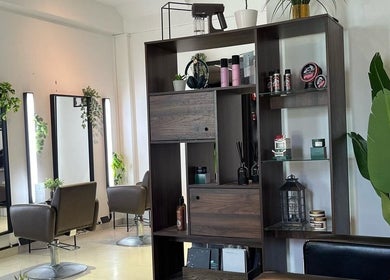Elegant interior of RASL: Refined Artisan Salon Lounge, Singapore, Singapore, SG. Modern chairs and greenery decor.