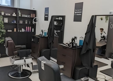 Interior of RABL: Refined Artisan Barber Lounge, Singapore, showcasing modern barber chairs and stylish decor.