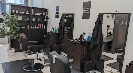 Interior of RABL: Refined Artisan Barber Lounge, Singapore, showcasing modern barber chairs and stylish decor.