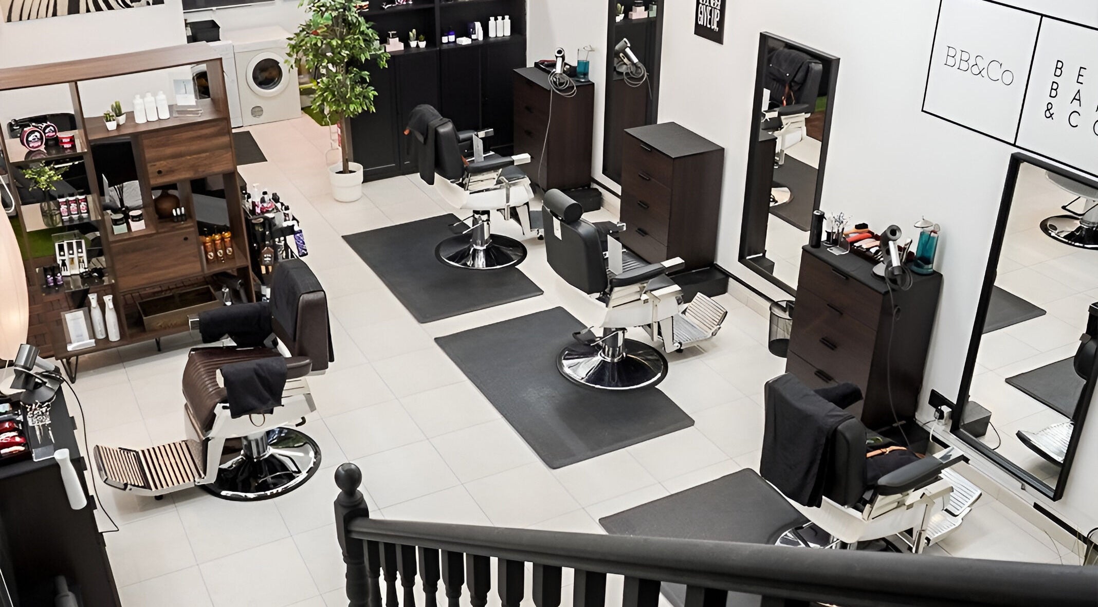 Interior view of Rabl Rasl Refined Artisan Barber & Salon Lounge in Singapore, featuring modern barber chairs.