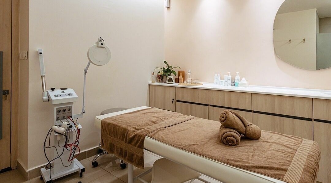 Spa treatment room at Calamantina Rabia, Amman, featuring a massage table and equipment for relaxation.