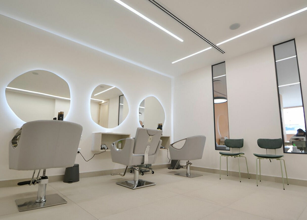 Chic salon interior at Calamantina Rabia in Amman, Amman Governorate, JO with modern styling chairs.