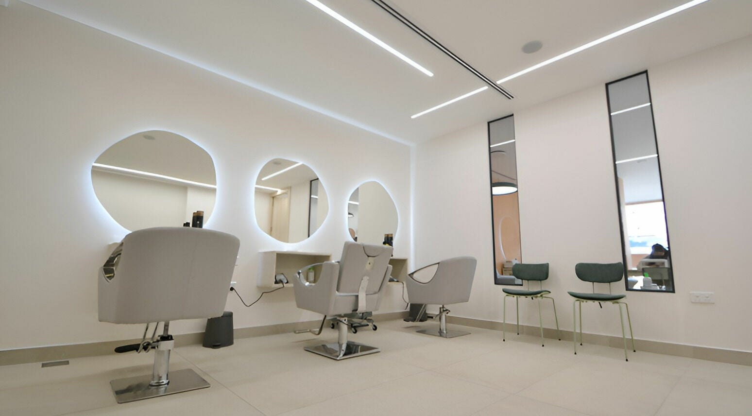 Chic salon interior at Calamantina Rabia in Amman, Amman Governorate, JO with modern styling chairs.