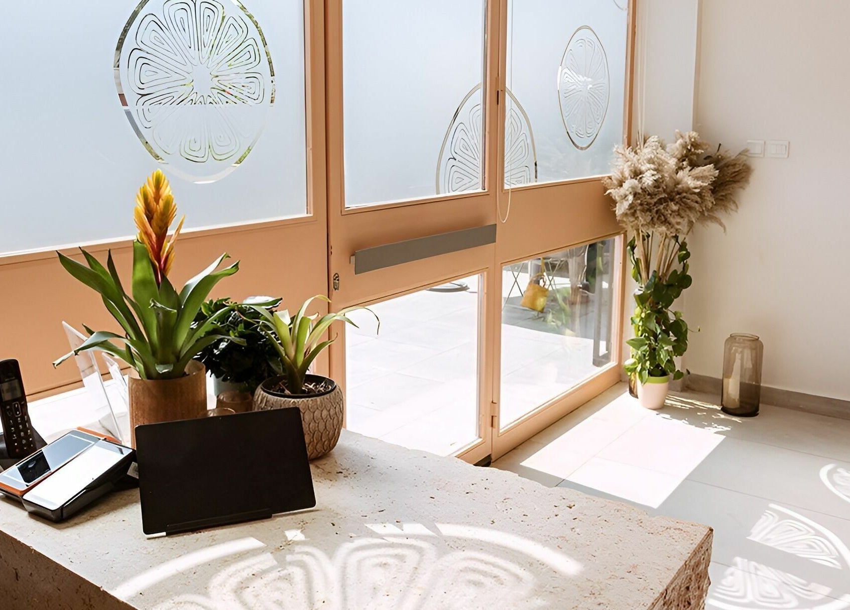 Calamantina Rabia welcoming bright reception area in Amman, Amman Governorate, JO with natural decor.