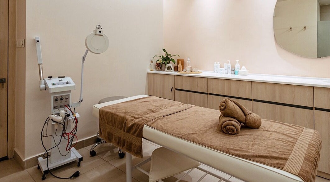 Treatment room at Calamantina Jubaiha in Amman, Amman Governorate, JO with spa bed and relaxing decor.