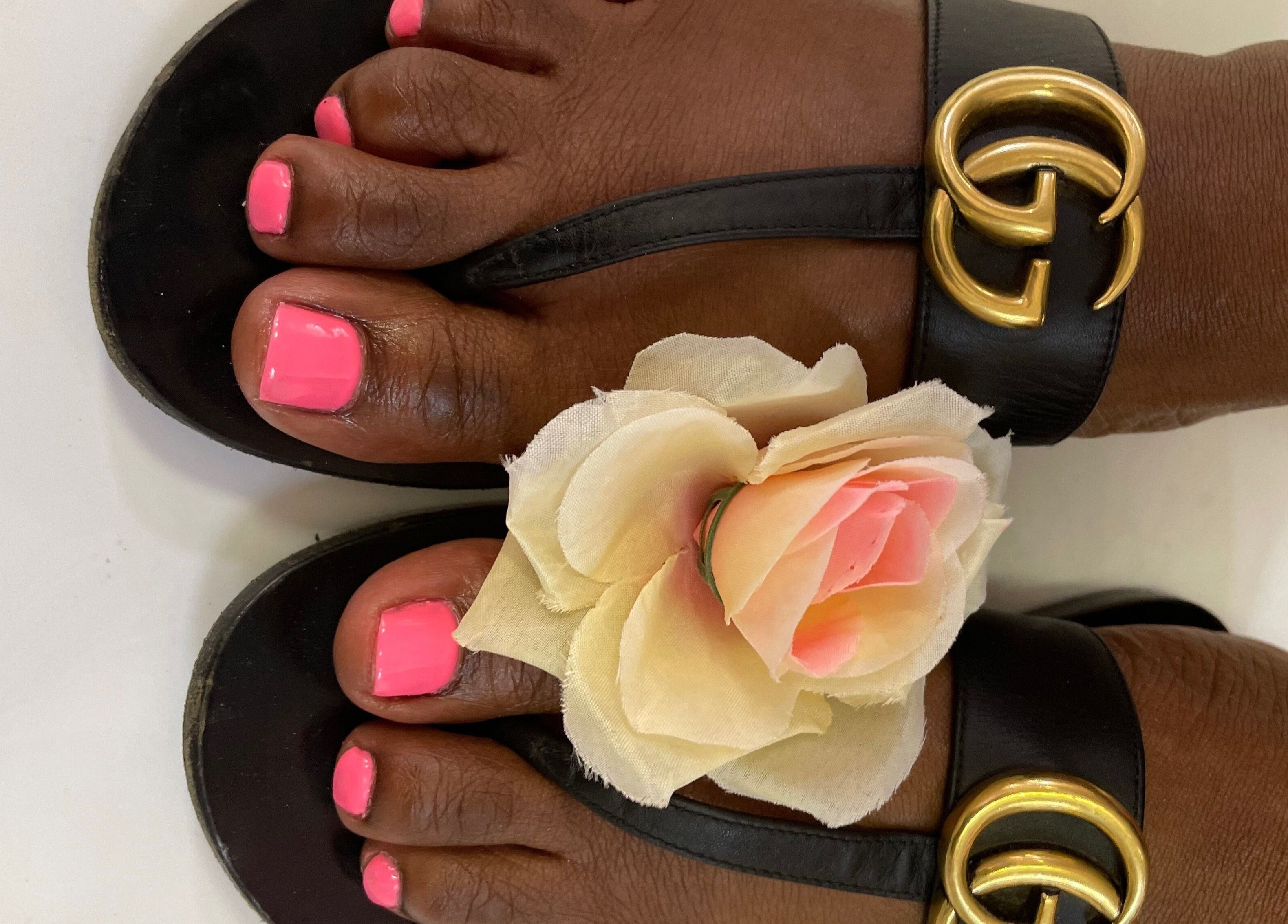 Elegant pink pedicure with floral accent at Brushed Nails by Nobi, Randburg, Gauteng, ZA.