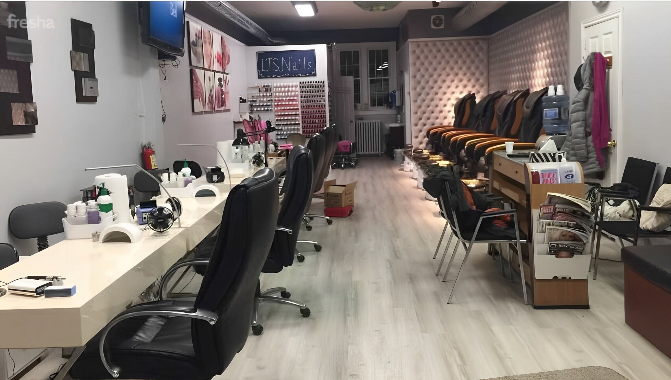 Elegant salon setup at LTS Nails, Toronto, Ontario, CA showcasing manicure stations and cozy seating.