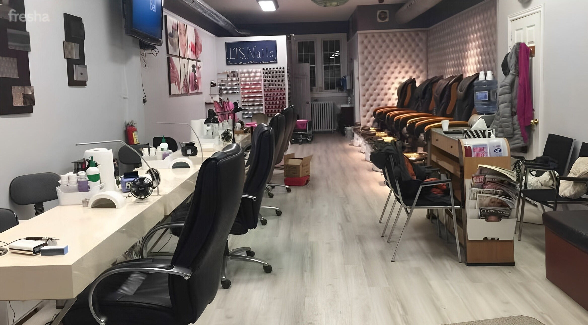 Elegant salon setup at LTS Nails, Toronto, Ontario, CA showcasing manicure stations and cozy seating.
