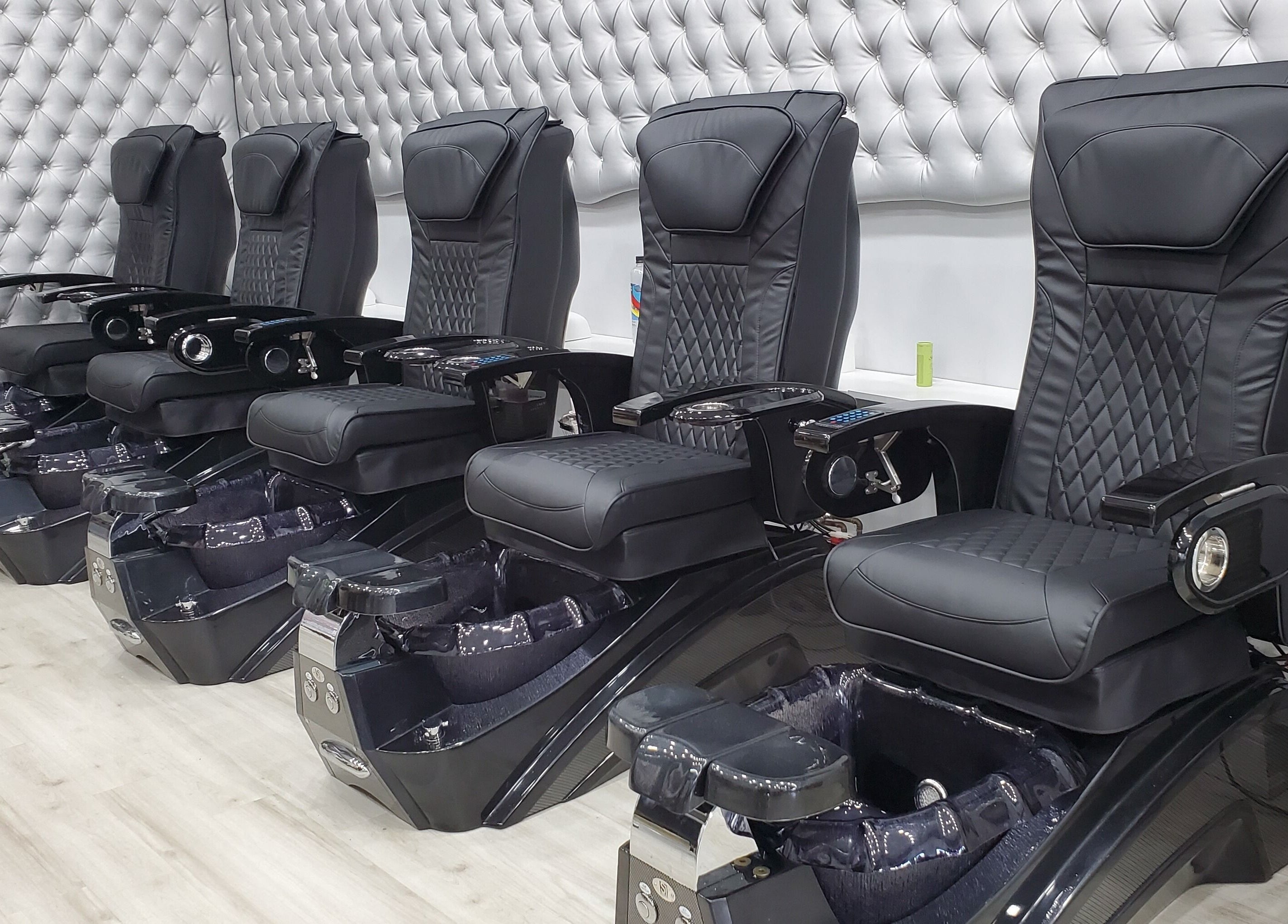 Luxurious black pedicure chairs at LTS Nails, Toronto, Ontario, CA for premium nail care.