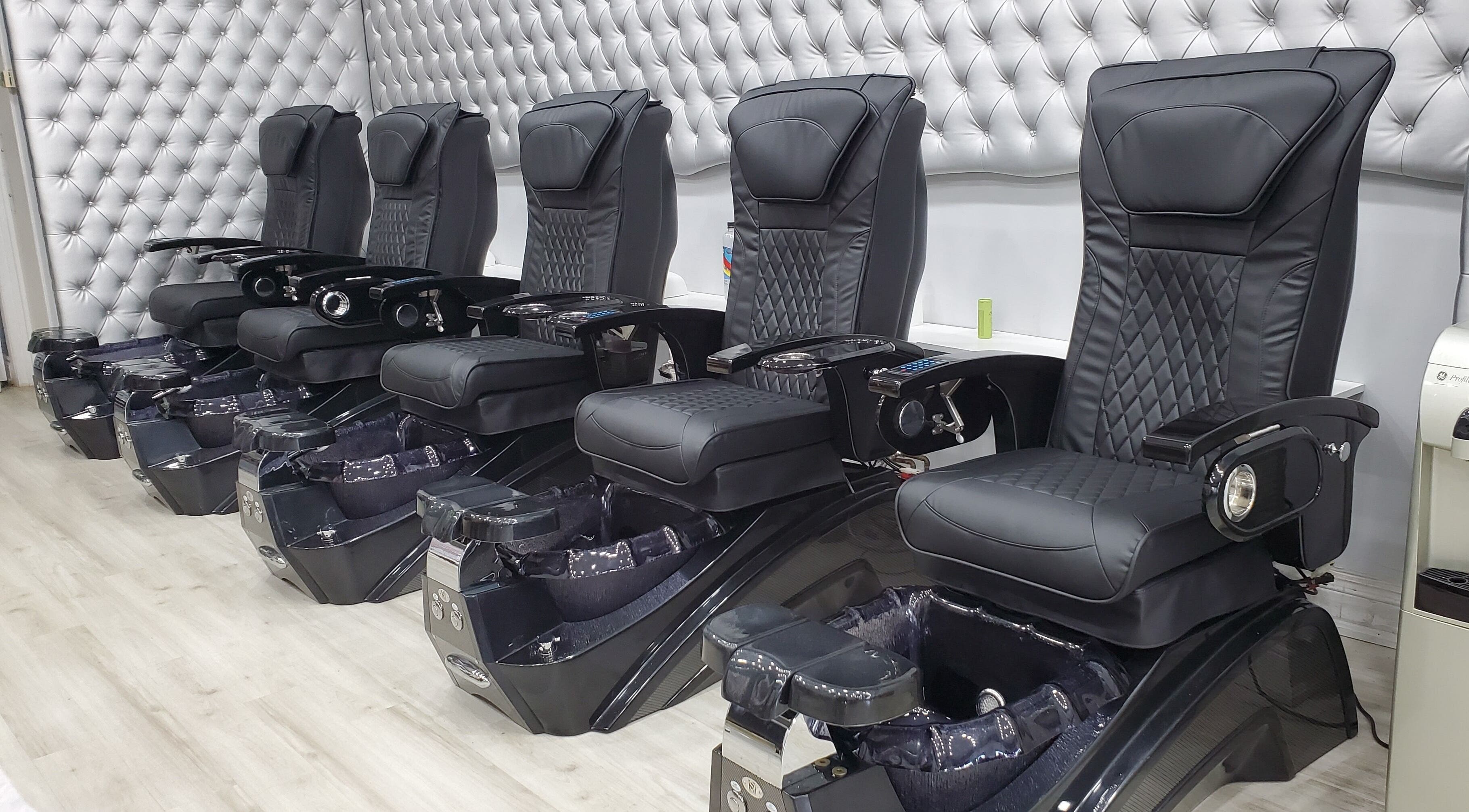 Luxurious black pedicure chairs at LTS Nails, Toronto, Ontario, CA for premium nail care.