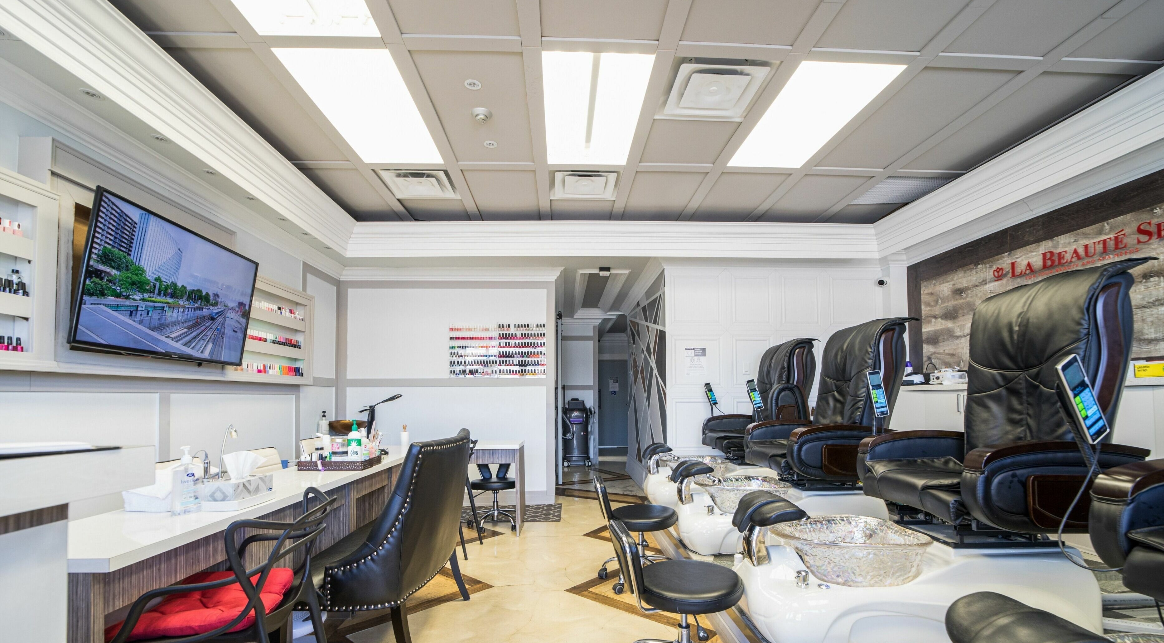 Chic pedicure and manicure stations at La Beaute Spa in Toronto, Ontario, CA offering a serene ambiance.