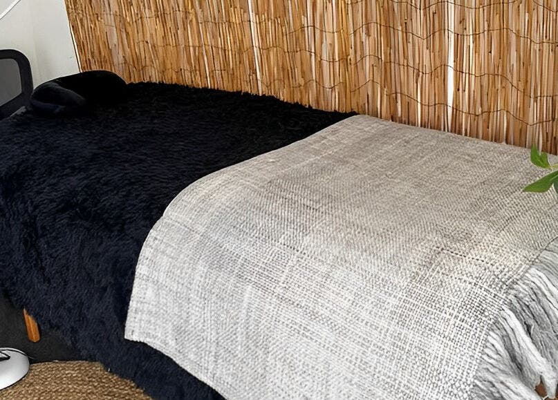 Relaxing lash extension room at Sister Lashes, Auckland, Auckland, NZ with a cozy bed and natural decor.