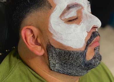 Man enjoying a facial treatment at Johnnyblades, Chicago, Illinois, US.