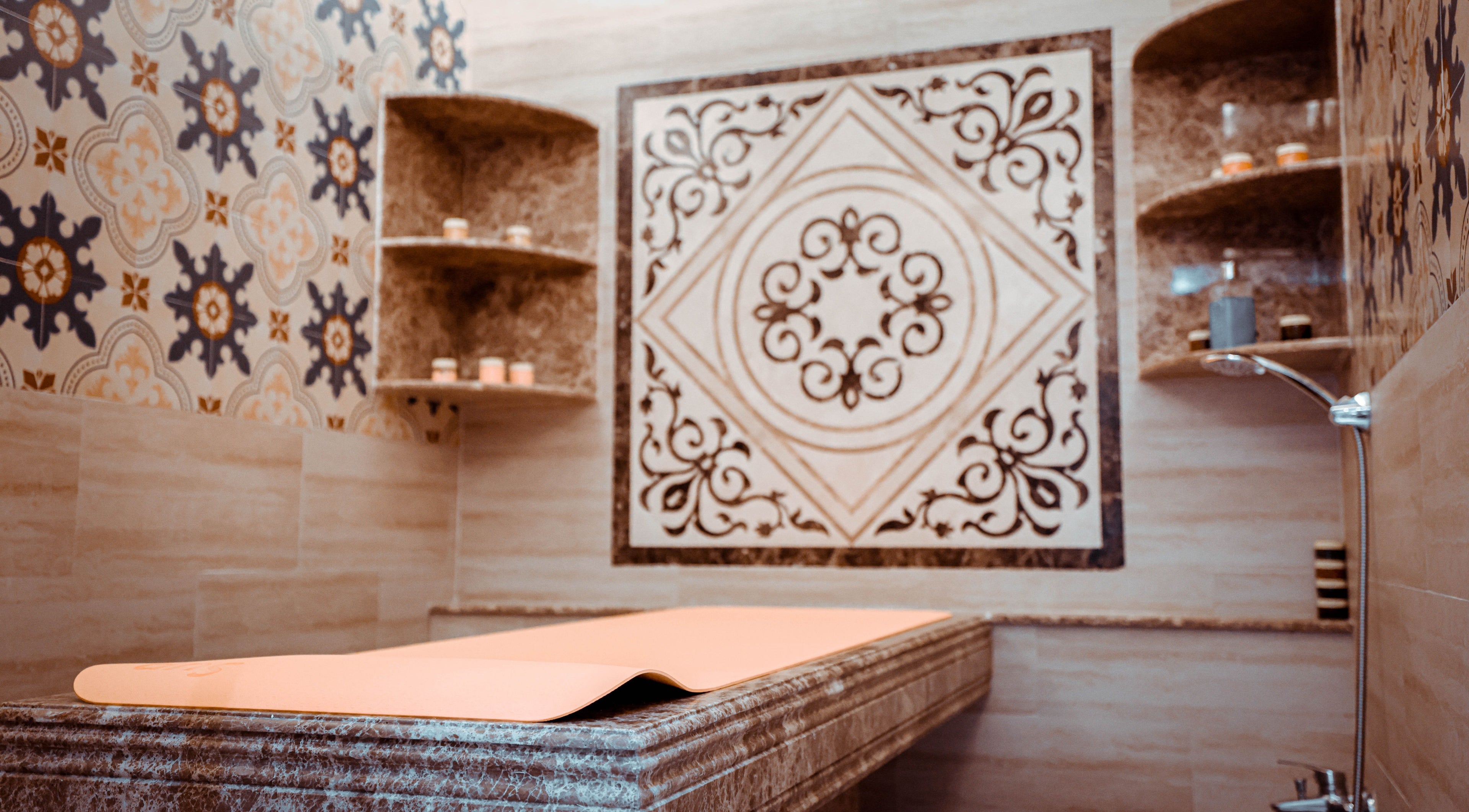 Luxurious treatment room at The Stars Barber in Dubai, AE with intricate tile design and ambient lighting.