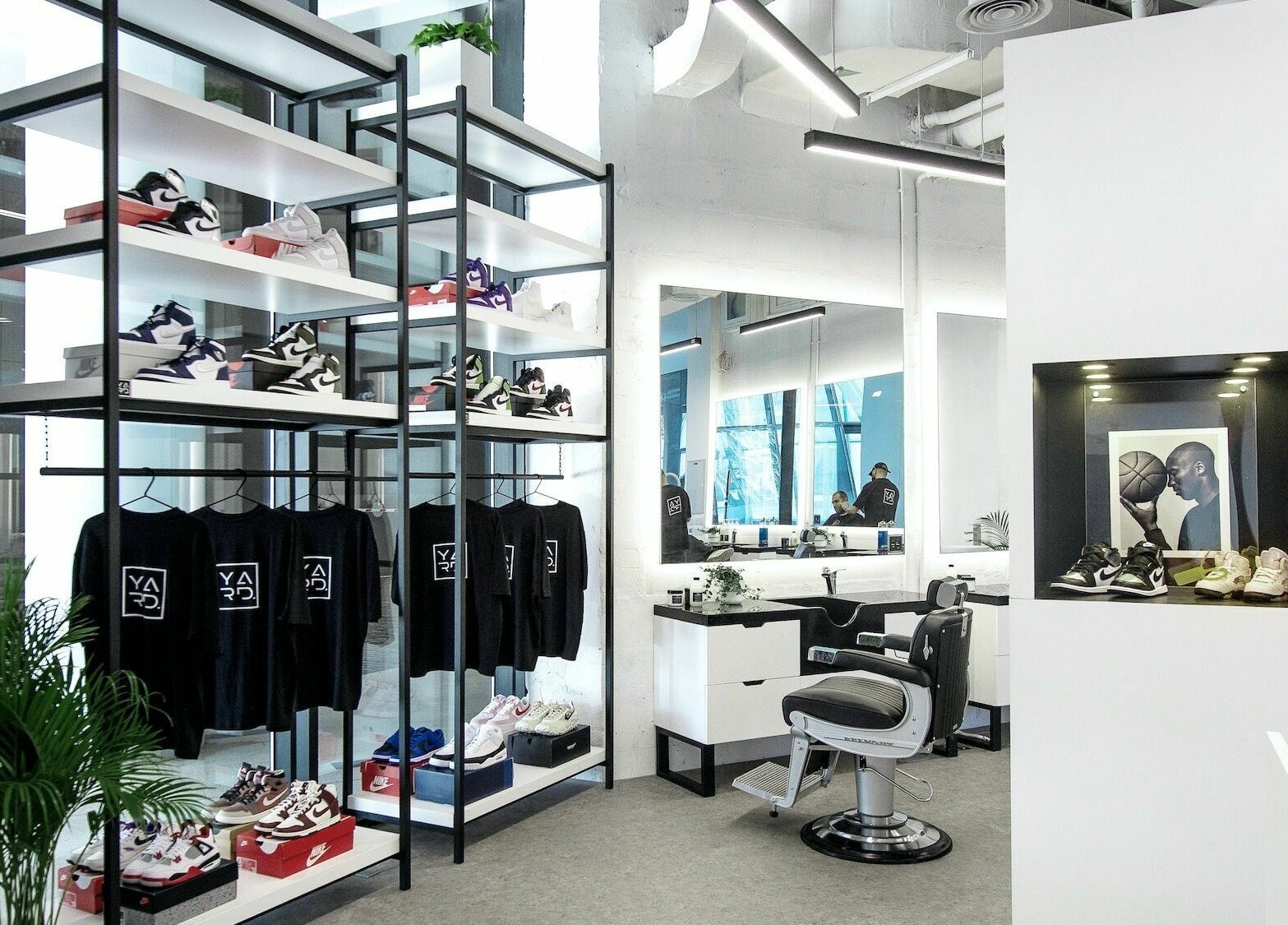 YARD Barber and Shop interior in Dubai, AE, showcasing trendy sneaker display and barber chair.