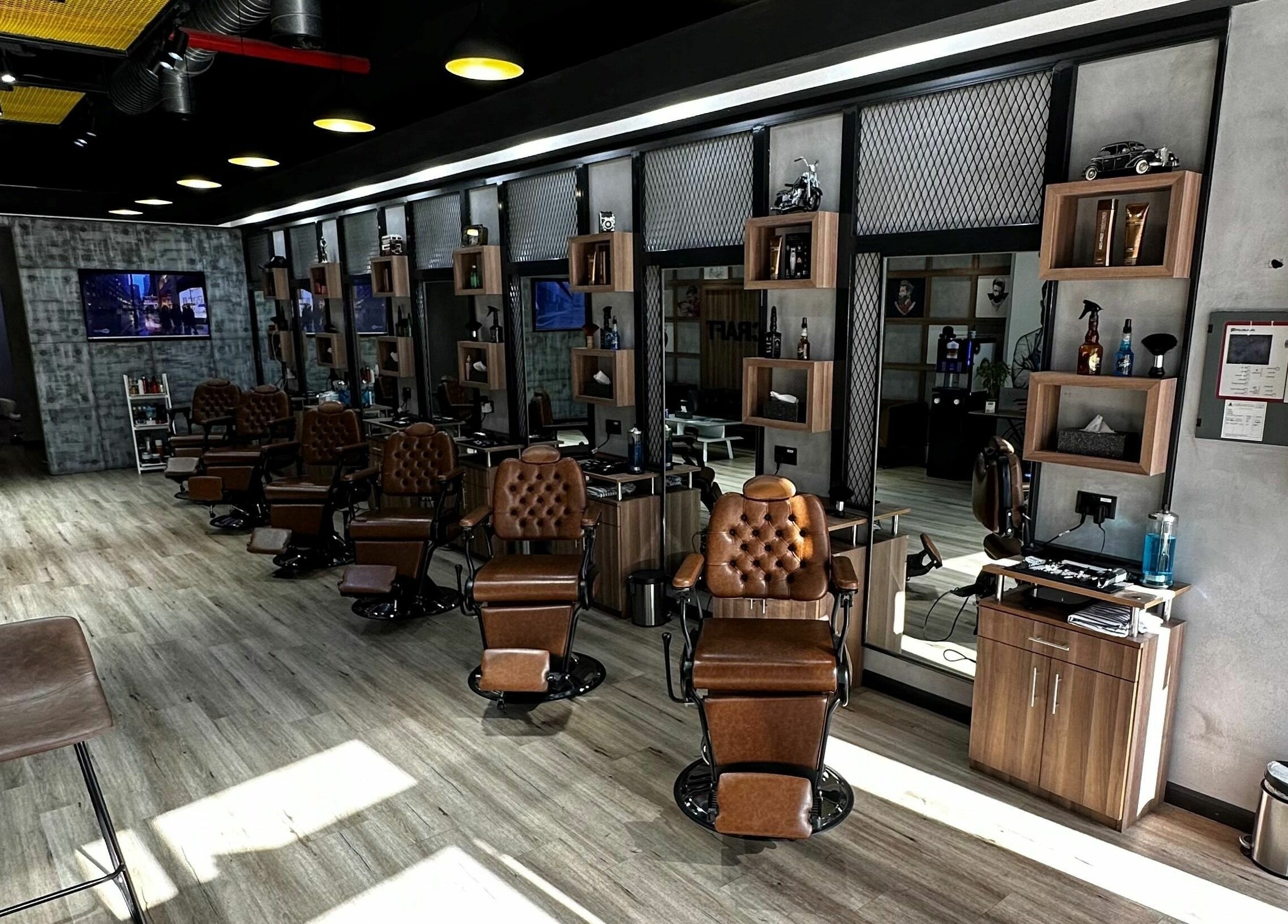 Sophisticated interior of Blade Craft in Dubai, Dubai, AE with vintage barber chairs and modern amenities.