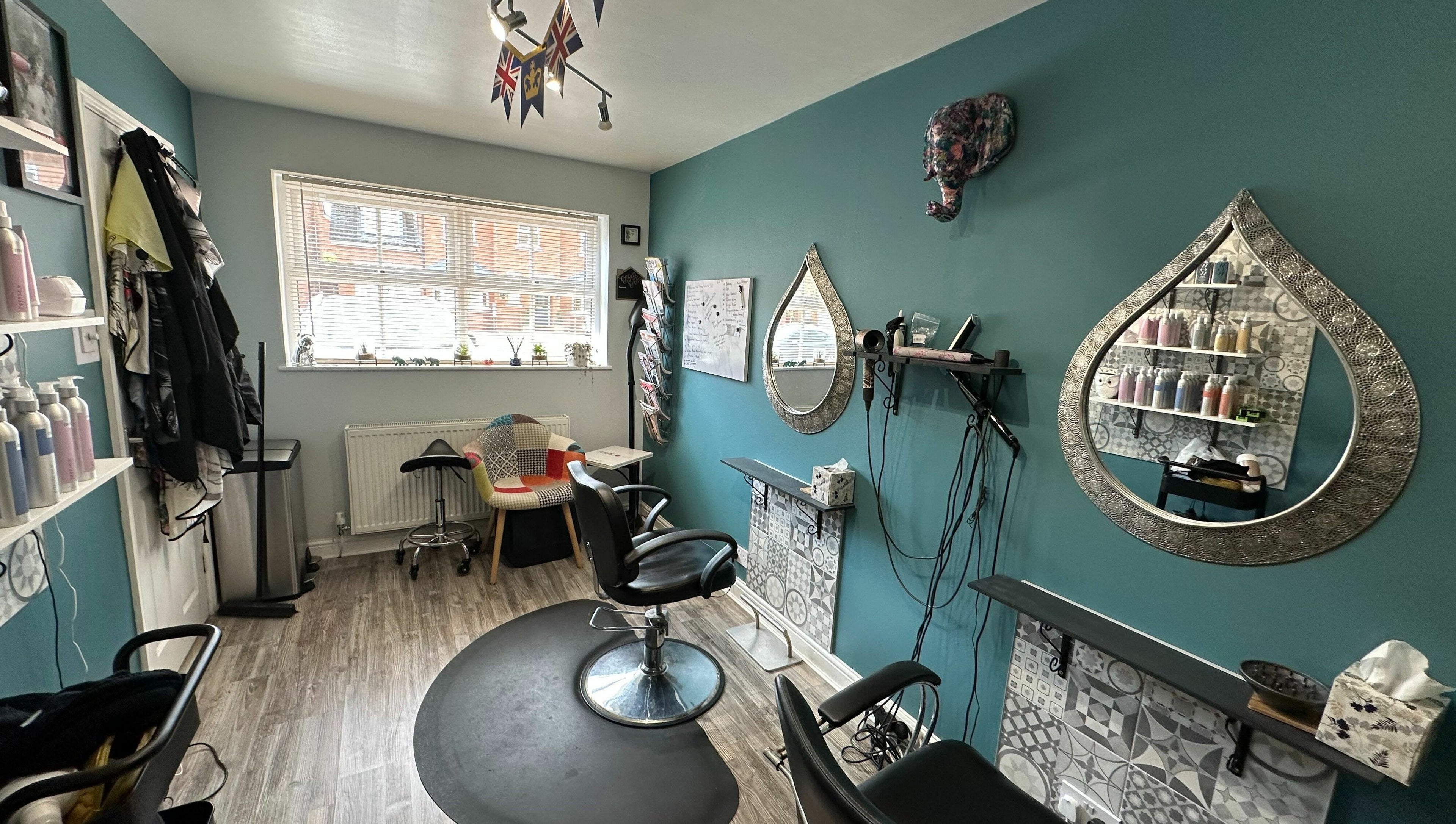 Cozy Xanadu salon in Wolston, England, GB with stylish decor and mirrors, offering beauty services.