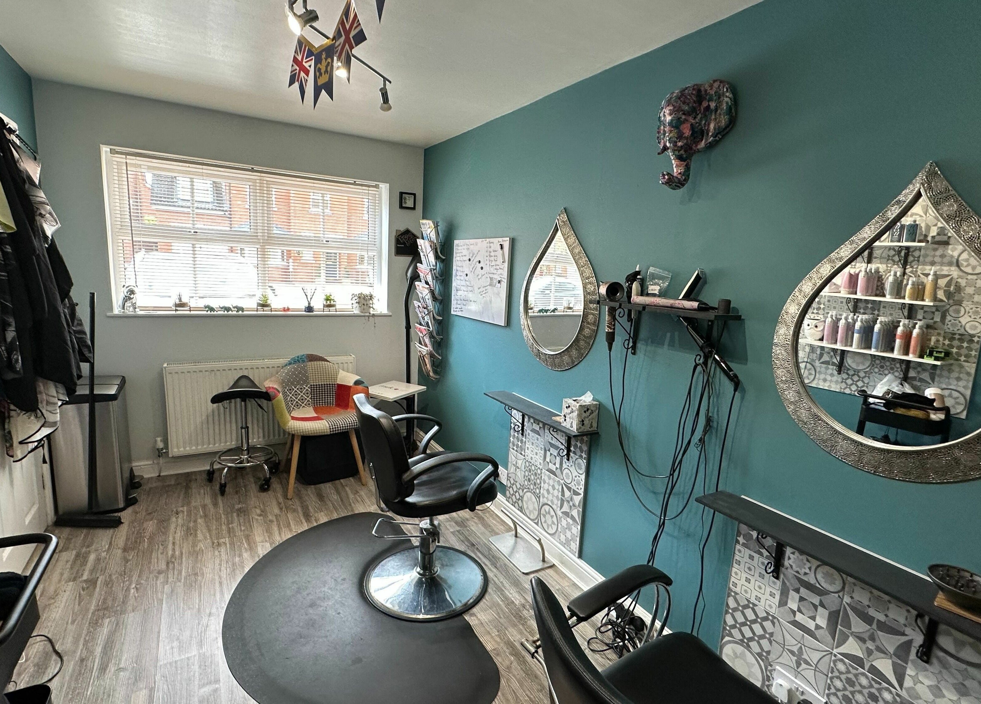 Cozy Xanadu salon in Wolston, England, GB with stylish decor and mirrors, offering beauty services.