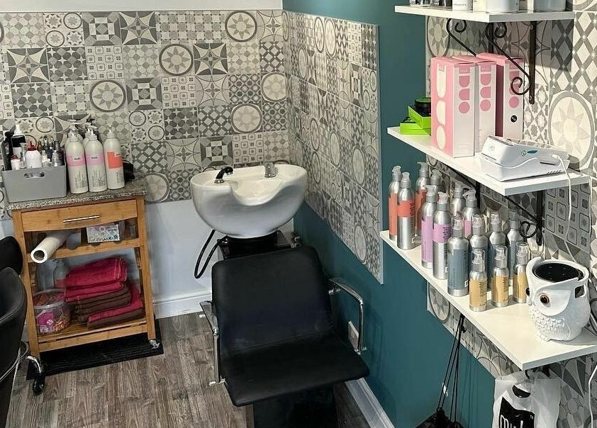 Stylish salon area at Xanadu, Wolston, England, GB featuring modern decor and professional hair products.